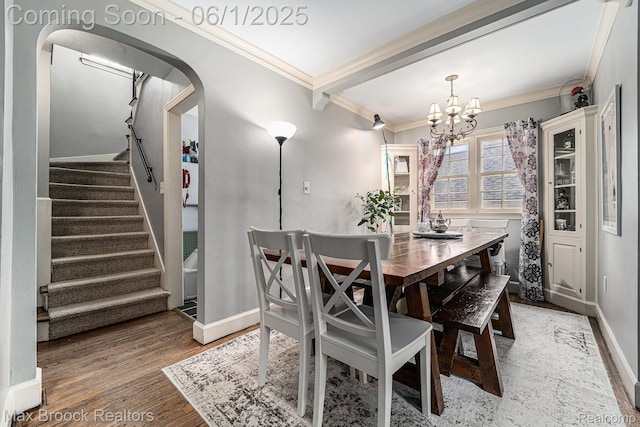 1312 Catalpa Dr, Royal Oak, MI 48067 - dining space featuring crown molding, stairway, a chandelier, light wood-style flooring, and baseboards