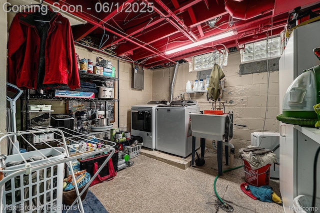 1312 Catalpa Dr, Royal Oak, MI 48067 - unfinished basement featuring washing machine and clothes dryer, concrete block wall, and tile patterned floors