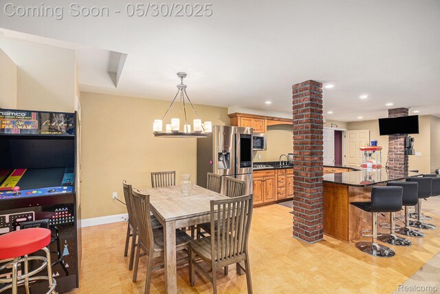 846 Majestic, Rochester, MI 48306 - dining space with ornate columns, a chandelier, light wood-style floors, baseboards, and recessed lighting