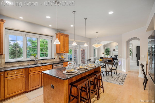 846 Majestic, Rochester, MI 48306 - kitchen with a sink, arched walkways, dishwasher, a center island, and wainscoting