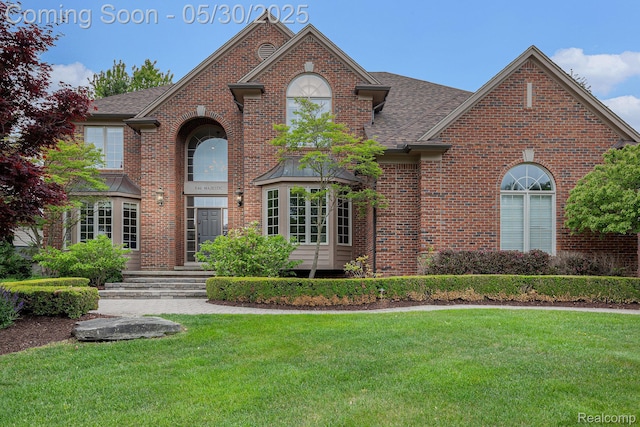 846 Majestic, Rochester, MI 48306 - traditional home featuring a front lawn, brick siding, and a shingled roof