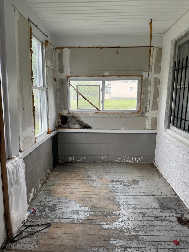 1101 W Rankin St, Flint, MI 48504 - spare room featuring hardwood / wood-style flooring and plenty of natural light