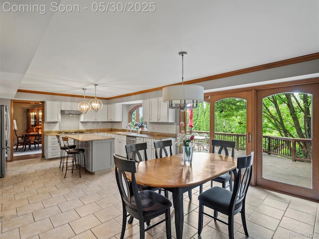 1552 Pebble Creek Dr, Rochester, MI 48307 - dining area with a chandelier, crown molding, and light tile patterned floors