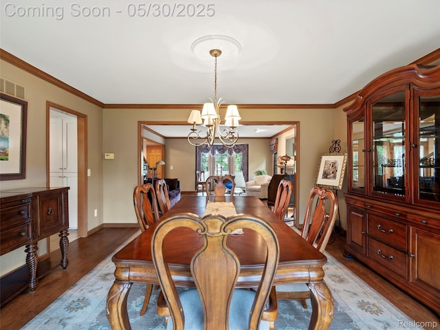 1552 Pebble Creek Dr, Rochester, MI 48307 - dining area with a chandelier, wood finished floors, ornamental molding, and baseboards