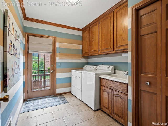 1552 Pebble Creek Dr, Rochester, MI 48307 - washroom featuring independent washer and dryer, cabinet space, baseboards, crown molding, and light tile patterned floors