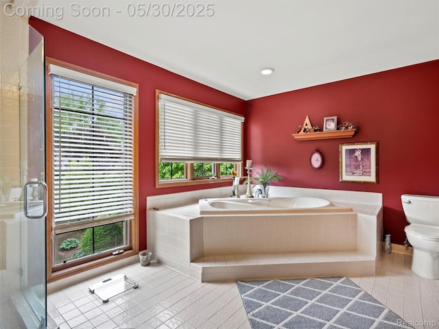 1552 Pebble Creek Dr, Rochester, MI 48307 - bathroom featuring toilet, a bath, tile patterned flooring, and a stall shower
