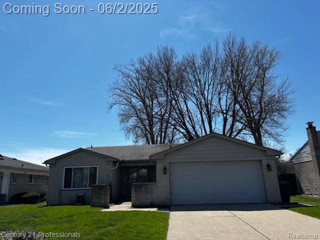 18201 Filmore St, Southfield, MI 48075 - ranch-style home with brick siding, an attached garage, a front yard, and driveway