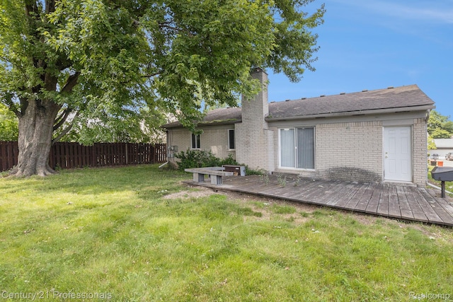18201 Filmore St, Southfield, MI 48075 - back of house featuring a chimney, a deck, and brick siding