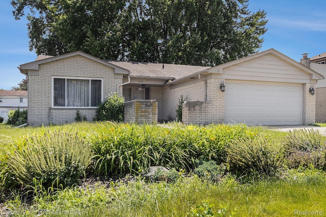 18201 Filmore St, Southfield, MI 48075 - view of front of house featuring brick siding and an attached garage