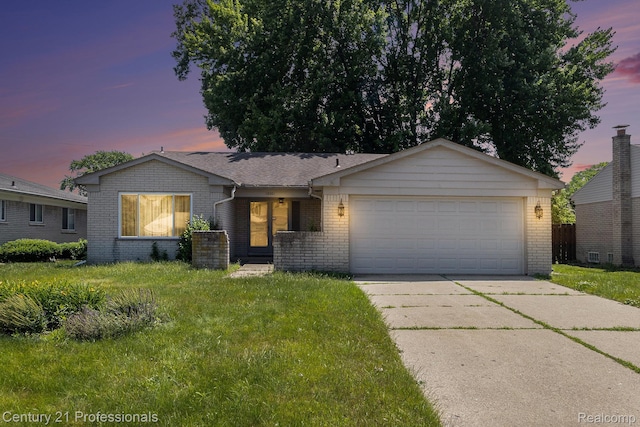 18201 Filmore St, Southfield, MI 48075 - ranch-style home featuring brick siding, concrete driveway, an attached garage, and a front lawn