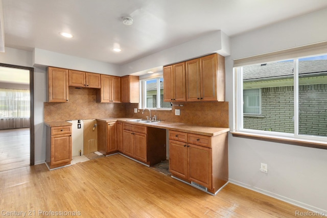 18201 Filmore St, Southfield, MI 48075 - kitchen featuring decorative backsplash, light wood-type flooring, brown cabinetry, and recessed lighting