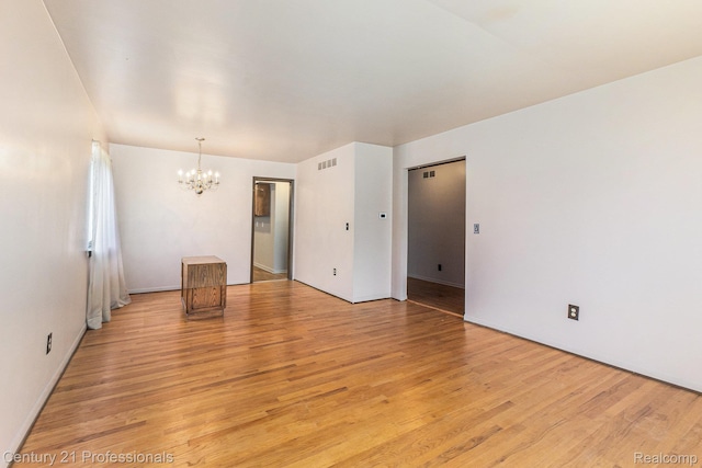 18201 Filmore St, Southfield, MI 48075 - spare room with a chandelier and light wood-style floors