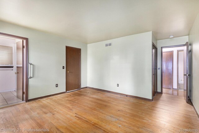 18201 Filmore St, Southfield, MI 48075 - unfurnished bedroom with light wood-type flooring and baseboards