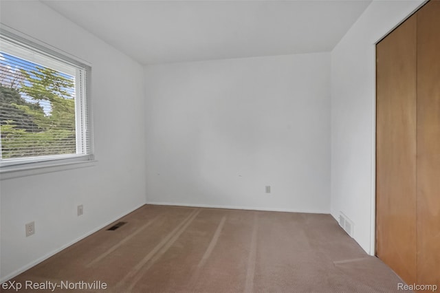 37923 Howell St, Livonia, MI 48154 - unfurnished bedroom with carpet floors, a closet, and baseboards