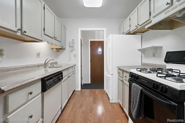 37923 Howell St, Livonia, MI 48154 - kitchen featuring white appliances, under cabinet range hood, a sink, light wood-type flooring, and light countertops