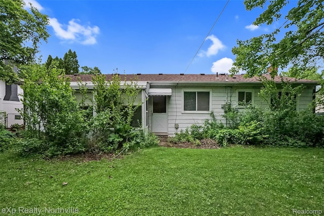 37923 Howell St, Livonia, MI 48154 - back of house with a lawn