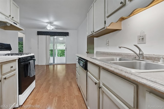 37923 Howell St, Livonia, MI 48154 - kitchen featuring gas range, a sink, light wood finished floors, ceiling fan, and light countertops