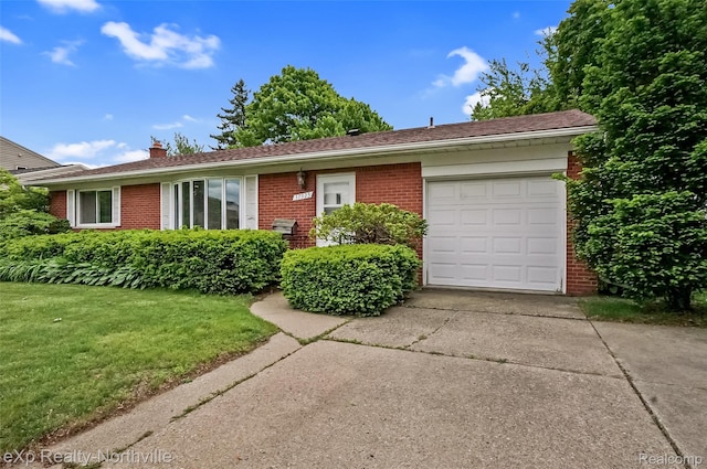 37923 Howell St, Livonia, MI 48154 - ranch-style house with brick siding, concrete driveway, an attached garage, a chimney, and a front yard