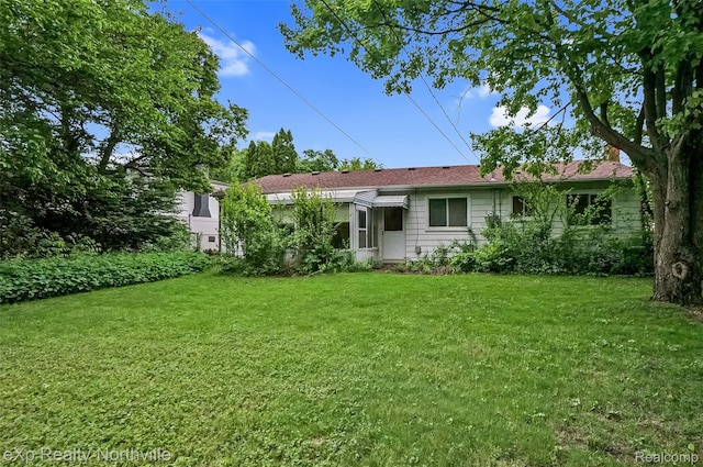 37923 Howell St, Livonia, MI 48154 - rear view of house featuring a lawn