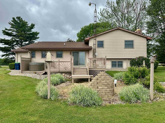 19379 Lincoln Rd, New Lothrop, MI 48460 - back of house with a deck and a lawn