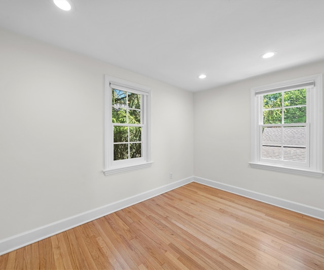 1015 Lincoln Ave, Ann Arbor, MI 48104 - spare room with baseboards, healthy amount of natural light, wood finished floors, and recessed lighting
