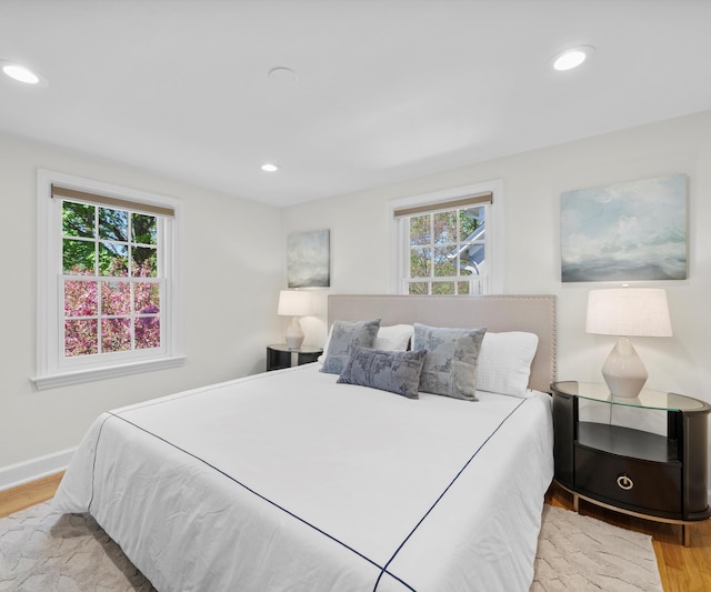 1015 Lincoln Ave, Ann Arbor, MI 48104 - bedroom with multiple windows, wood finished floors, recessed lighting, and baseboards