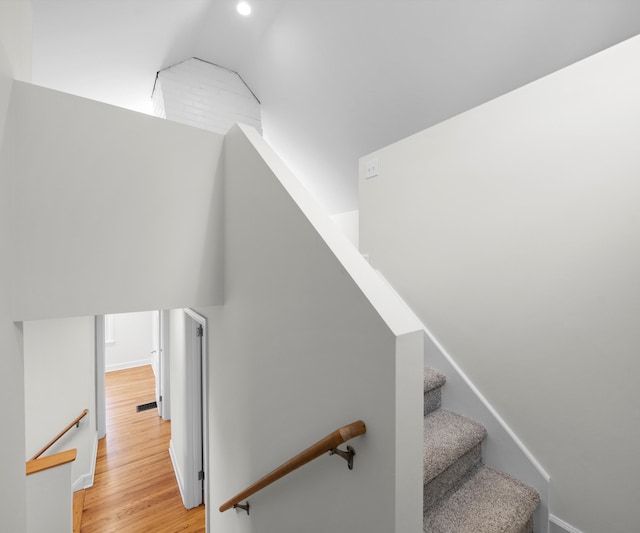 1015 Lincoln Ave, Ann Arbor, MI 48104 - stairs with wood finished floors, recessed lighting, and baseboards