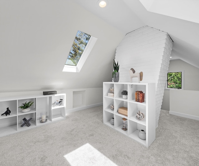 1015 Lincoln Ave, Ann Arbor, MI 48104 - additional living space with a skylight, lofted ceiling, and carpet flooring