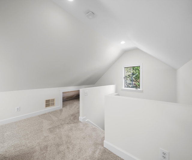 1015 Lincoln Ave, Ann Arbor, MI 48104 - additional living space with vaulted ceiling, carpet flooring, baseboards, and recessed lighting