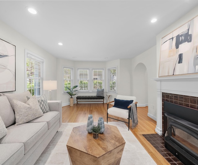 1015 Lincoln Ave, Ann Arbor, MI 48104 - living area with arched walkways, plenty of natural light, light wood-style floors, recessed lighting, and baseboards