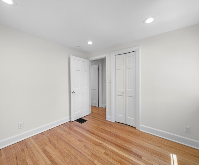1015 Lincoln Ave, Ann Arbor, MI 48104 - unfurnished bedroom featuring baseboards, recessed lighting, light wood-style floors, and a closet