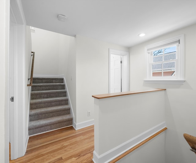 1015 Lincoln Ave, Ann Arbor, MI 48104 - staircase with wood finished floors, baseboards, and recessed lighting