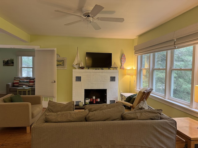 31 Mohawk Trl, New Buffalo, MI 49117 - living area featuring healthy amount of natural light, a brick fireplace, and wood finished floors