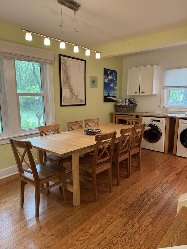 31 Mohawk Trl, New Buffalo, MI 49117 - dining space with washer / dryer, light wood finished floors, and track lighting