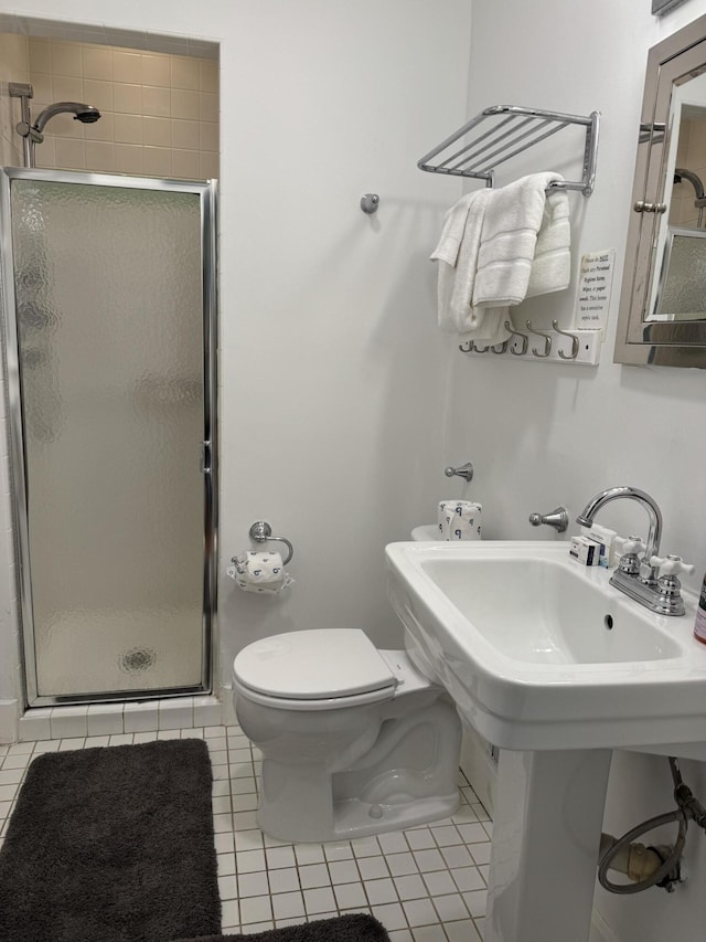 31 Mohawk Trl, New Buffalo, MI 49117 - full bathroom featuring a stall shower, tile patterned floors, toilet, and a sink