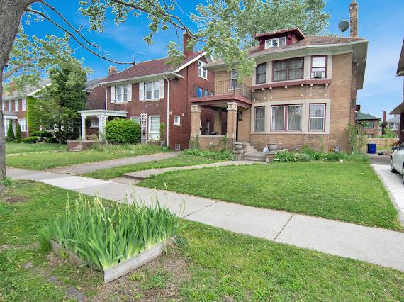 2041 Atkinson St, Detroit, MI 48206 - american foursquare style home featuring a front yard