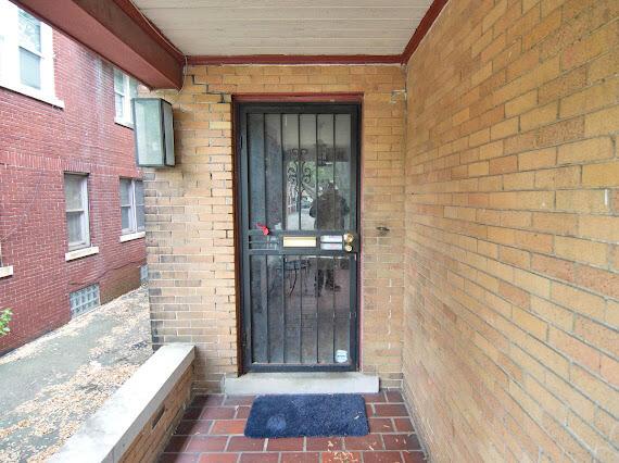 2041 Atkinson St, Detroit, MI 48206 - entrance to property with brick siding