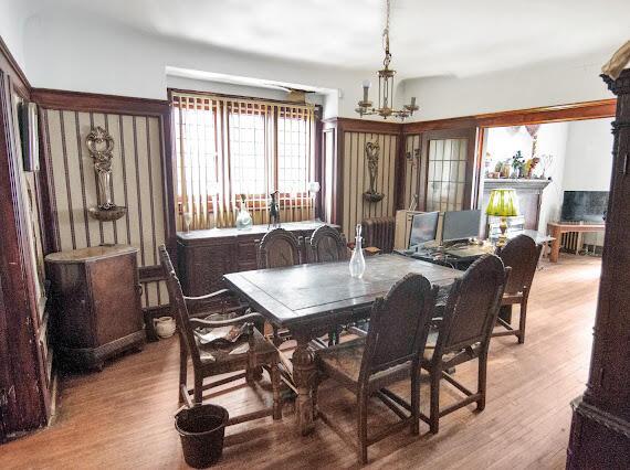 2041 Atkinson St, Detroit, MI 48206 - dining area with wood finished floors and a chandelier