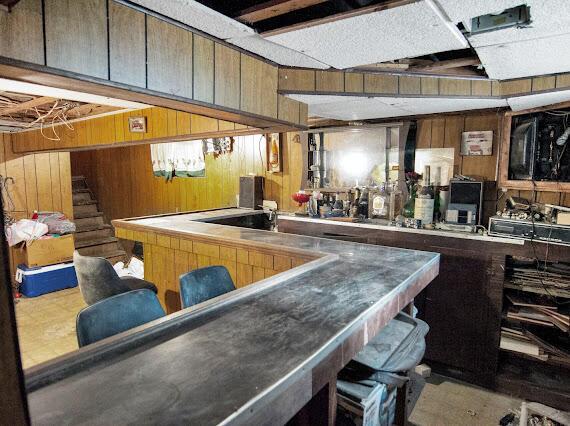 2041 Atkinson St, Detroit, MI 48206 - indoor dry bar with wooden walls and stairs