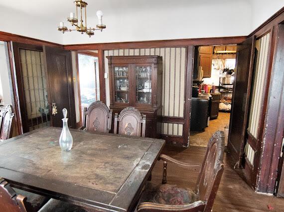 2041 Atkinson St, Detroit, MI 48206 - dining area featuring a chandelier and wood finished floors