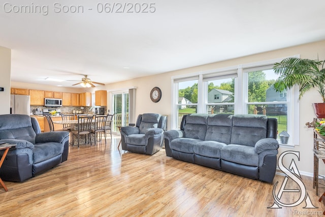 6420 Crestview Dr, Holly, MI 48442 - living area featuring light wood-style floors and ceiling fan