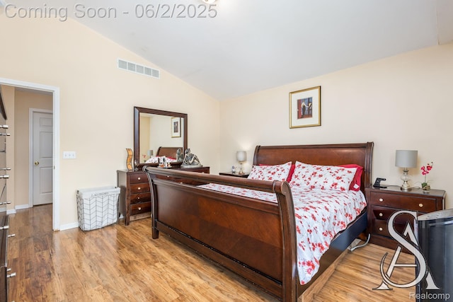 6420 Crestview Dr, Holly, MI 48442 - bedroom featuring wood finished floors, high vaulted ceiling, and baseboards