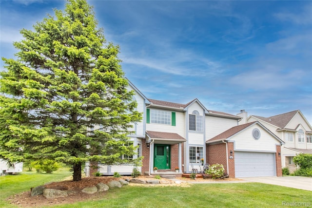 2864 Mystic Dr, Ann Arbor, MI 48103 - view of front facade with brick siding, a garage, a front yard, and driveway
