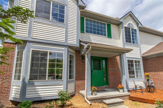 2864 Mystic Dr, Ann Arbor, MI 48103 - entrance to property featuring brick siding and a wooden deck
