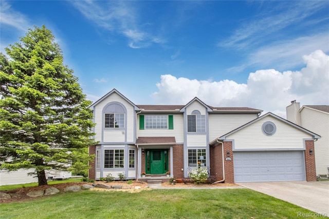 2864 Mystic Dr, Ann Arbor, MI 48103 - view of front of property featuring a garage, brick siding, concrete driveway, and a front yard