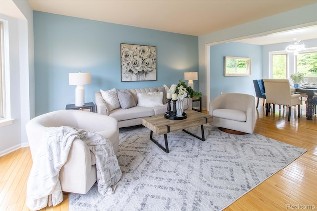 2864 Mystic Dr, Ann Arbor, MI 48103 - living area with wood-type flooring, a chandelier, and baseboards