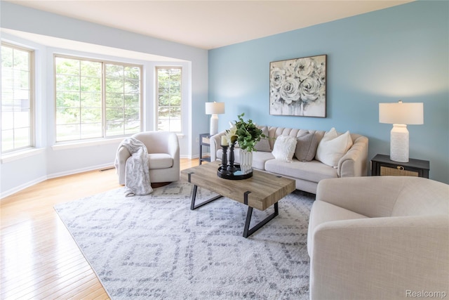 2864 Mystic Dr, Ann Arbor, MI 48103 - living area with wood finished floors, plenty of natural light, and baseboards