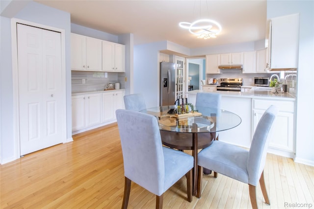 2864 Mystic Dr, Ann Arbor, MI 48103 - dining room featuring light wood-style flooring and a chandelier