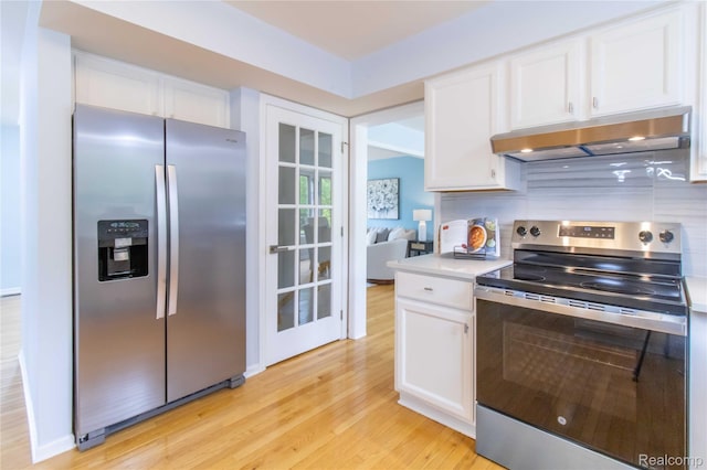2864 Mystic Dr, Ann Arbor, MI 48103 - kitchen featuring stainless steel appliances, under cabinet range hood, white cabinetry, and light wood finished floors