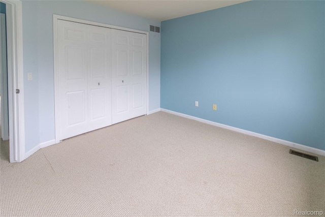 2864 Mystic Dr, Ann Arbor, MI 48103 - unfurnished bedroom featuring carpet, a closet, and baseboards